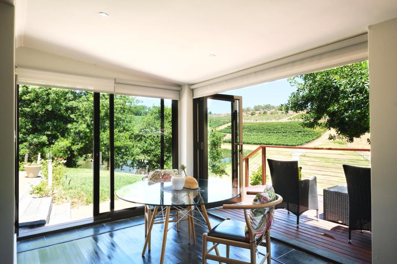 Alluvia Boutique Winery & Luxury Accommodation Stellenbosch Exteriör bild A room with a view of the vineyards