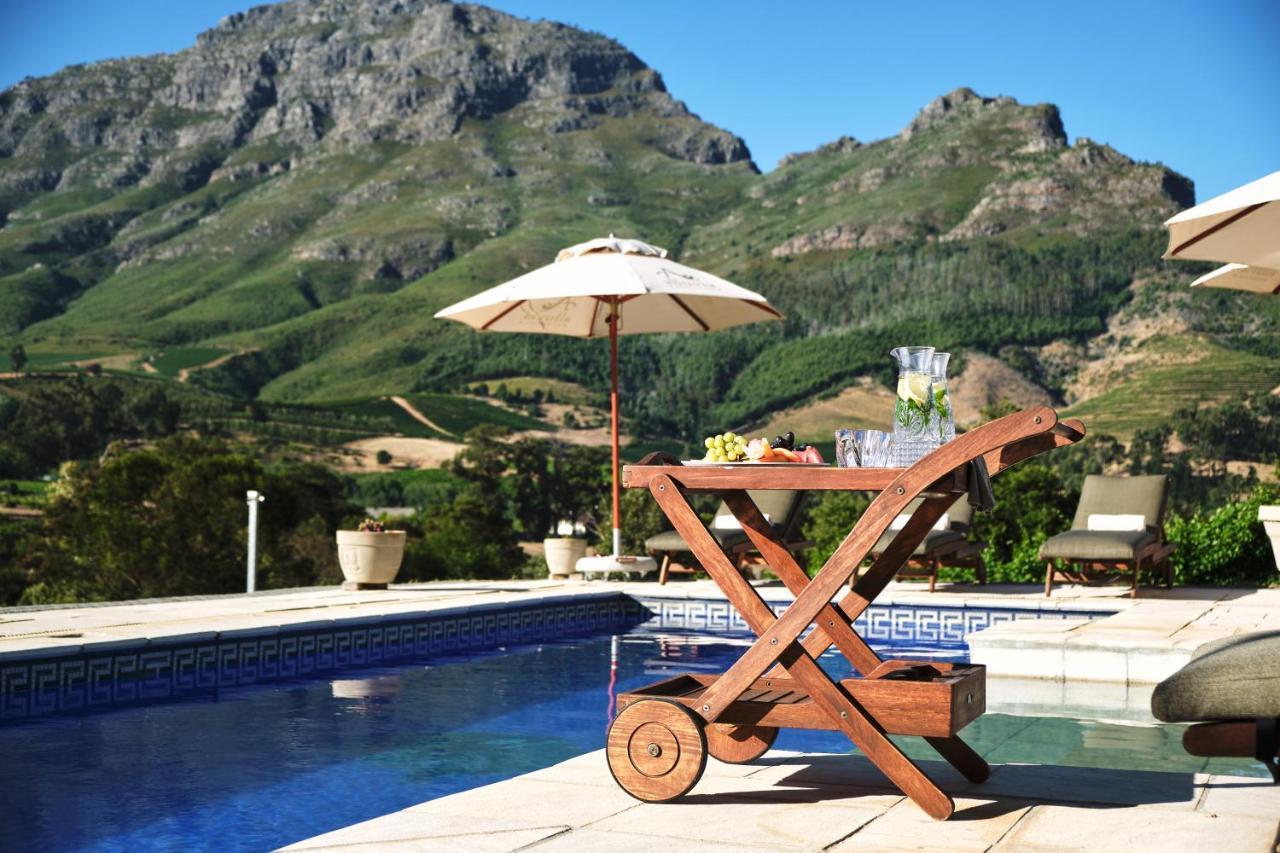 Alluvia Boutique Winery & Luxury Accommodation Stellenbosch Exteriör bild A poolside bar cart
